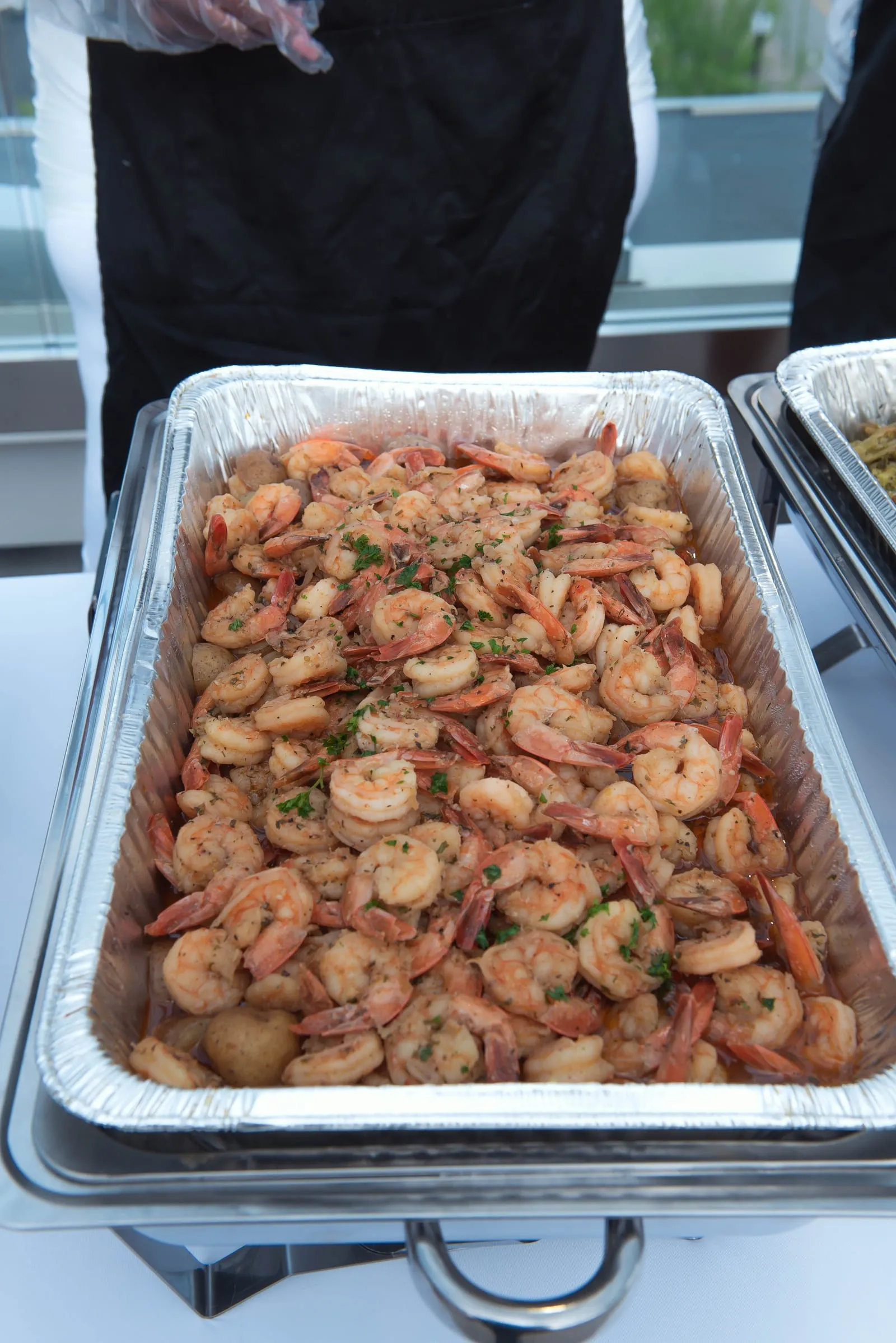 Large catering tray of seasoned shrimp ready to serve